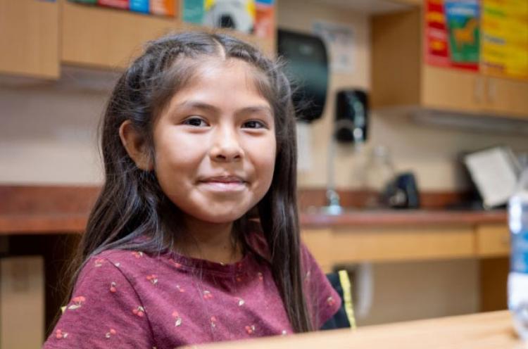 Female student smiling at the camera.