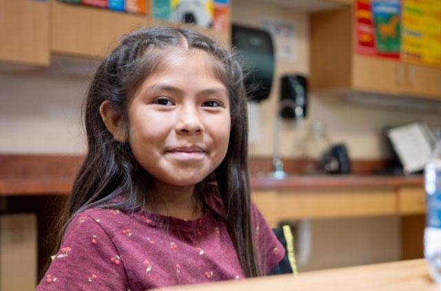 Female student smiling at the camera.